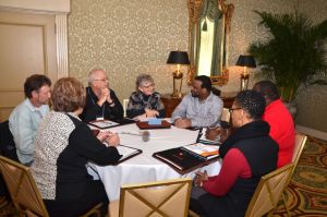 Mentor-Connect Mentor Peggie Weeks (center) listens to the grant proposal ideas of her mentees from Grayson College (Denison, Texas) and Albany Technical College (Albany, Georgia). Pictured from left to right, are Djuna Forrester, Alan McAdams, and Steven Davis from Grayson College, Weeks, and Joseph Ford, Chase Mumford, and Angela Davis from Albany Technical College.  (Photo by David Hata)