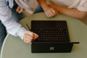 A photo of two people looking at a tablet