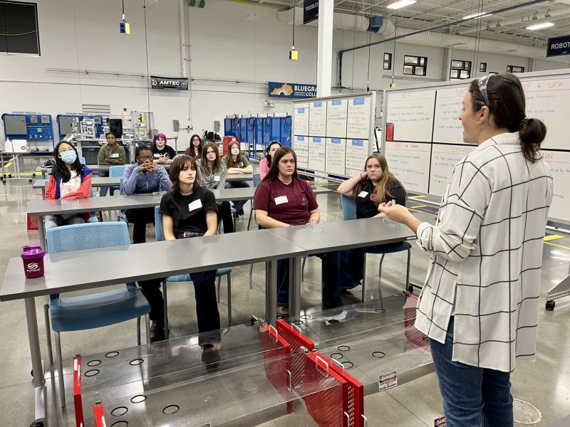 sara palmer talks to group of young girls