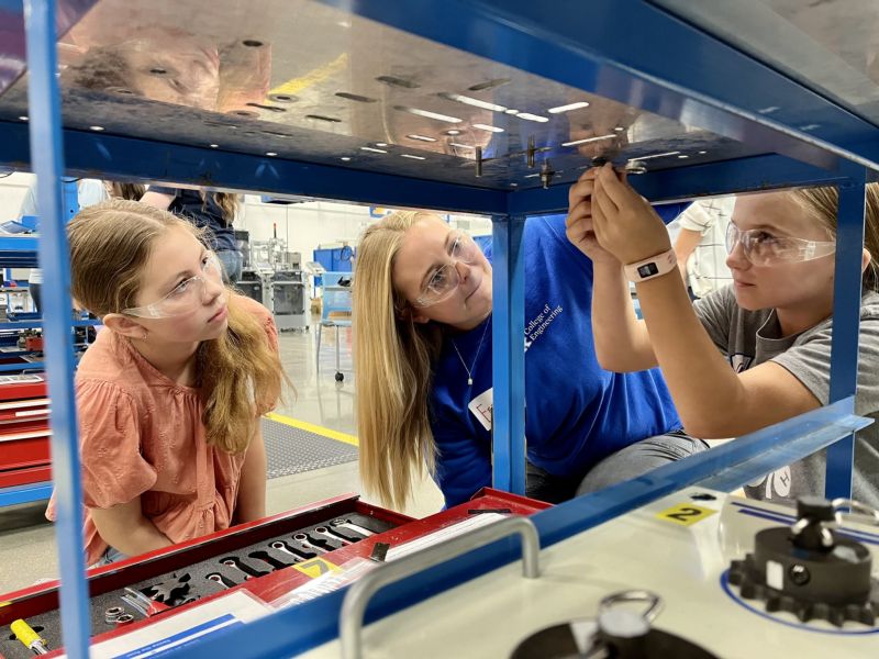 girls work on hands-on activity