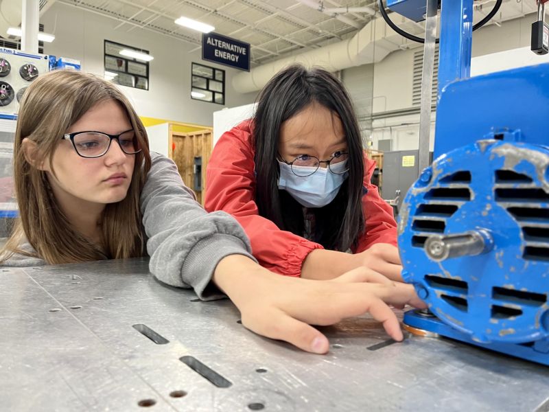 girls work on hands-on activity