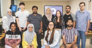 Nine students who participated in the 2022 UCTDDAS boot camp with Yildirim, standing far left, and Danisman, far right.