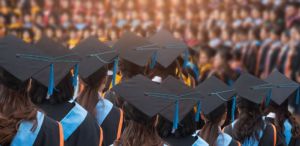 An image of graduates with their hats