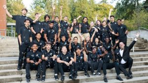 South Puget Sound Community College President Tim Stokes sits with student volunteers at the SPSCC Foundation’s 2019 gal