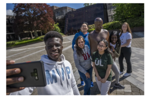 A screenshot of the University of Limerick's website, showing students wearing university attire